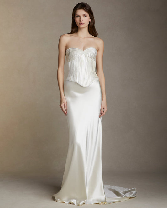 Model wearing the Ella strapless basque waist bodice with silk wool embroidery and smooth satin skirt against neutral background