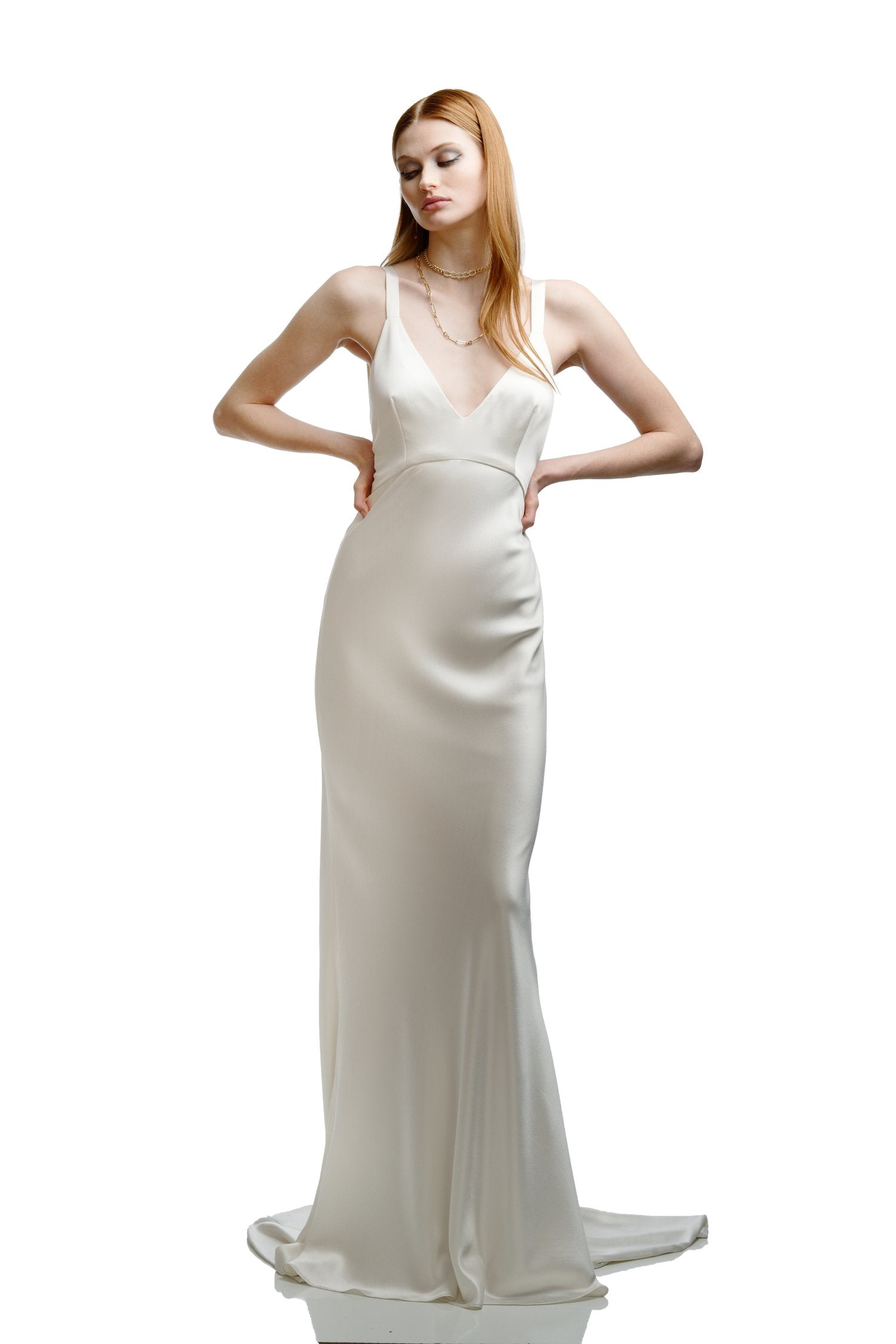 Woman wearing a white evening gown on a white background